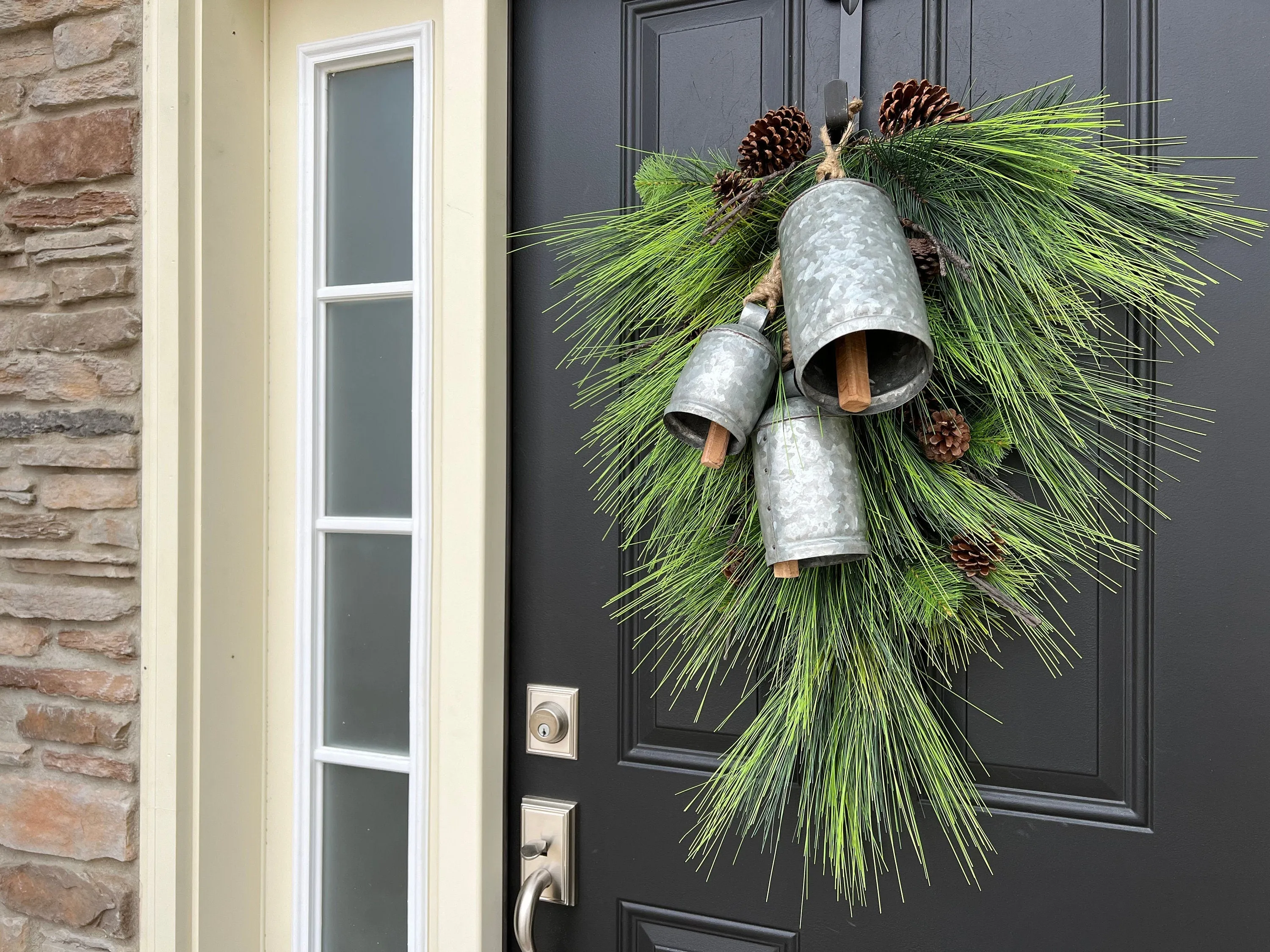Winter Pine Teardrop Swag with Decorative Bells and Pinecones