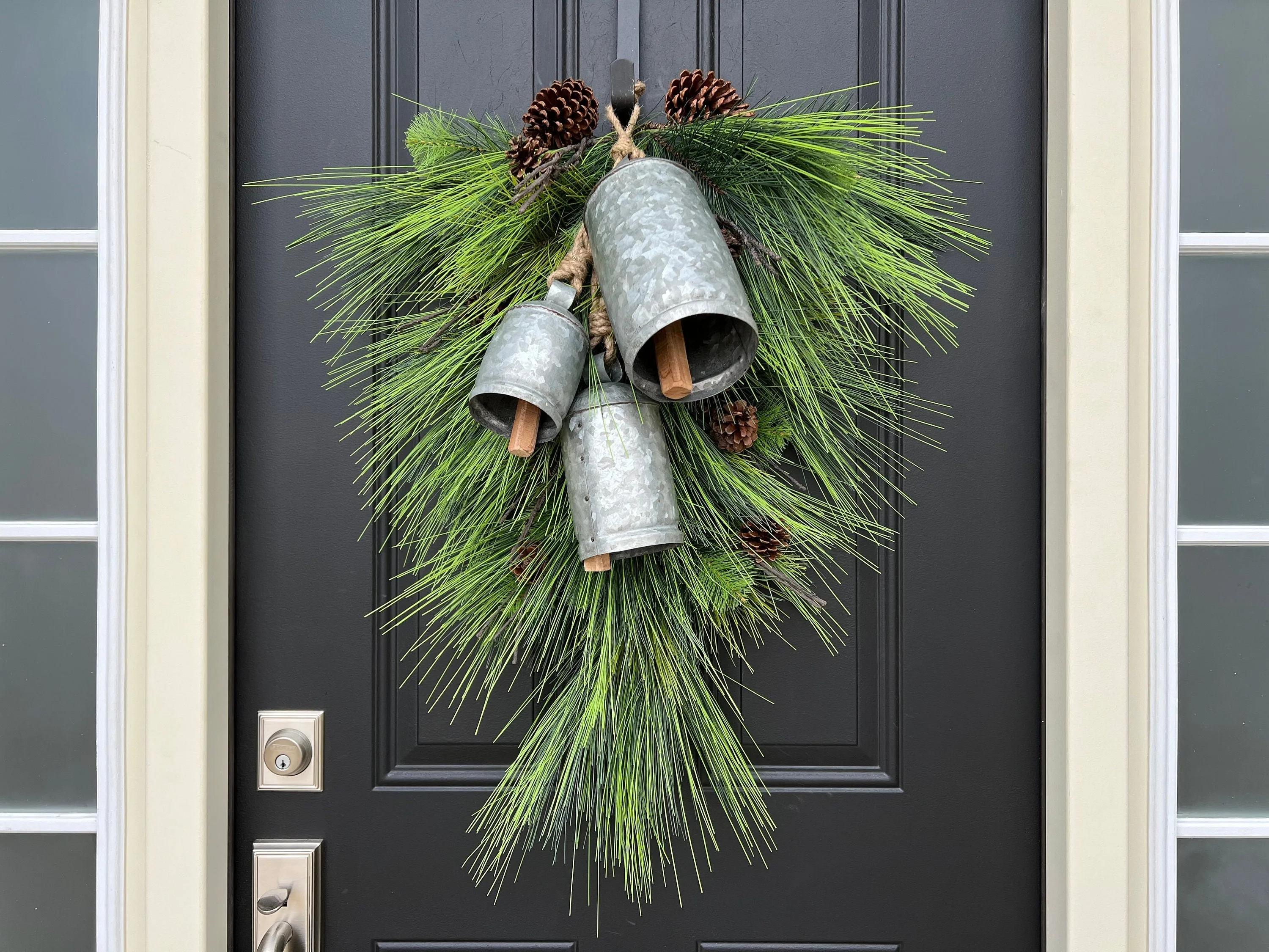 Winter Pine Teardrop Swag with Decorative Bells and Pinecones