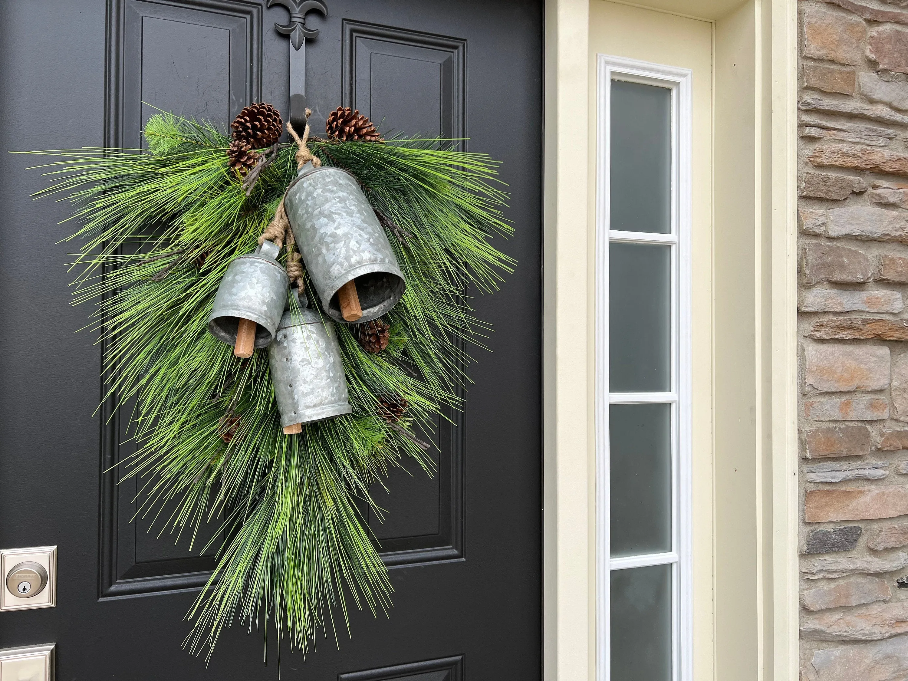 Winter Pine Teardrop Swag with Decorative Bells and Pinecones
